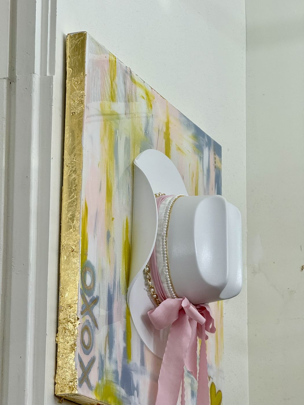 Custom canvas with a white cowboy hat and pink bow